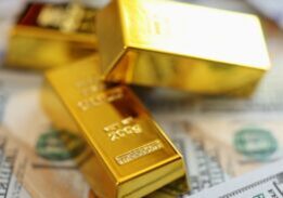 Close-up,Of,Stack,Small,Golden,Ingots,On,Pots,Of,Money