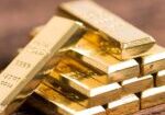 stack of gold bar on wood background